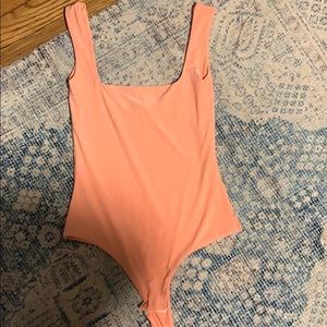 Light neon orange bodysuit